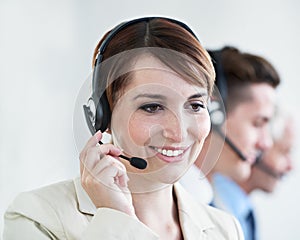 We are always happy to help. a beautiful young customer service agent working in an office.