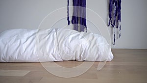 Happy toddler boy hiding under blanket on floor. Smiling child. Gimbal motion