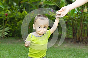 Happy Toddler Boy Learning to Walk