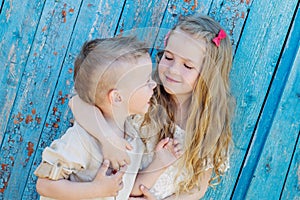 Happy Toddler brother and sister hugging