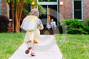 Happy Toddler girl arriving home from school