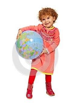 Happy toddler girl with world globe