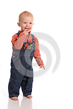 Happy toddler in overalls