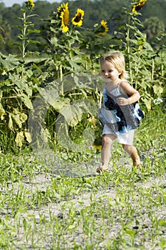 Happy toddler running in field