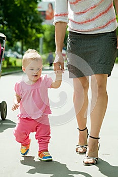 Happy toddler walking on road