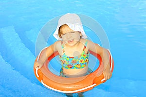 Happy todler girl learning to swim