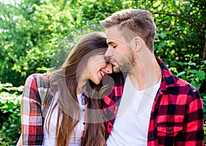 Happy together. Couple in love. Enjoying each other. Cuddling with darling. Man hipster and pretty woman in love. Summer photo