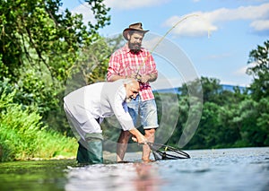 Always happy together. fly fish hobby of businessman. retirement fishery. happy fishermen friendship. Two friends