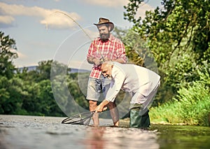 Always happy together. fly fish hobby of businessman. retirement fishery. happy fishermen friendship. Two friends