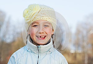 Happy toothless girl outdoors photo