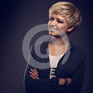 Happy toothy smiling young blond woman with short bob hair style