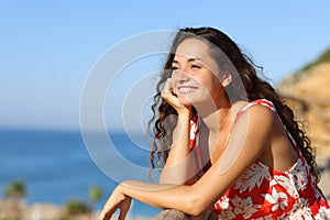 Happy tourist contemplating beach views