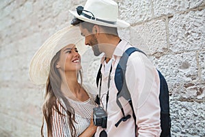 Happy tourist couple in love traveling