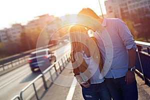 Happy tourist couple with map traveling outdoors