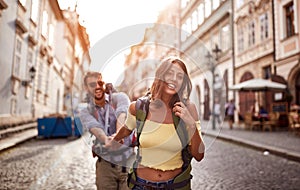 Happy tourist couple sightseeing; Traveller lifestyle