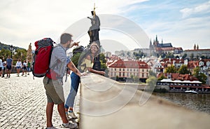 Happy tourist couple taking a selfie; Traveller lifestyle