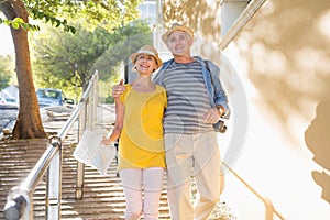 Happy tourist couple walking in the city