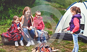 Happy tourist family on journey hike. mother and children fry sa