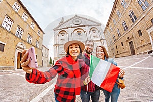 Happy Tourist friends with italian flag travels