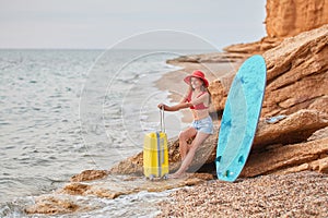 Happy tourist on vacation. Blue surfboard to catch waves. Sense of adventure, summer time and surfing idea. Copy space
