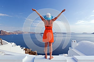 Happy tourist woman on Santorini island, Greece. Travel