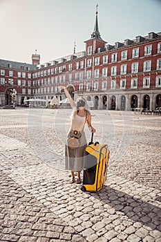 Happy tourist woman in spain traveling around europe post-covid
