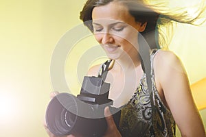 Happy tourist woman in summer casual clothes hat with photo camera