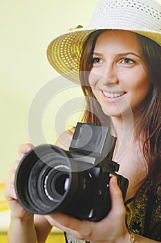Happy tourist woman in summer casual clothes hat with photo camera