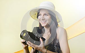 Happy tourist woman in summer casual clothes hat with photo camera