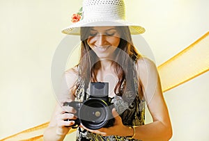 Happy tourist woman in summer casual clothes hat with photo camera