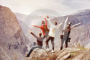 Happy tourists having fun mountain top