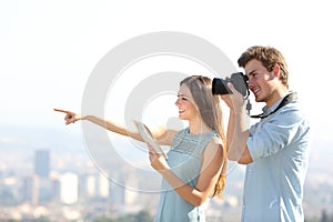 Happy tourists taking photos in a city outskirts