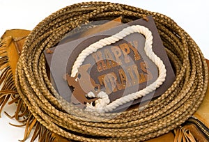 Happy trails sign circled with rawhide lasso rope photo