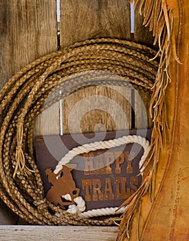 Happy trails wood shelf with rope & chaps