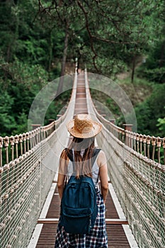 Happy travel woman on vacation concept. Funny traveler enjoy her trip and ready to adventure photo