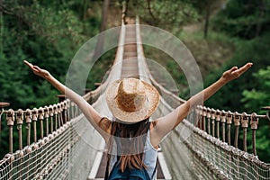 Happy travel woman on vacation concept. Funny traveler enjoy her trip and ready to adventure. photo