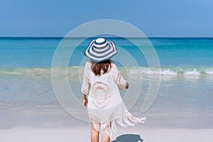 Happy traveler Asian woman  enjoys at tropical beach on vacation. Summer on beach concept