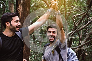 Happy traveler man standing and hand clamping together,Enjoying backpacking concept