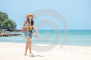 Happy traveler and tourism women travel summer on the beach.