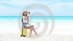 Happy traveler and tourism young women travel summer on the beach.