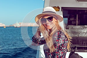 Happy traveler woman toothy smile on cruise ship on Mediterranean sea