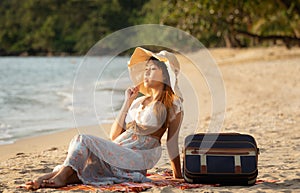 Happy traveler woman on tropical beach vacation