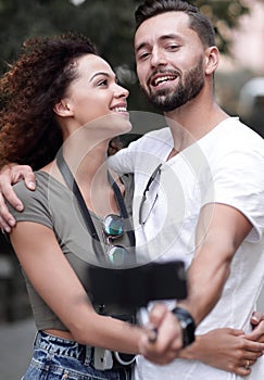 Happy traveling couple making selfie, romantic mood.