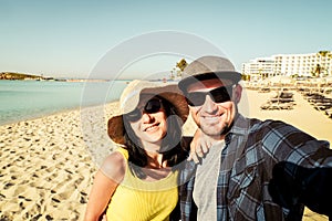 Happy traveling couple making selfie sea background . Sunny summer holidays. Romantic mood. Stylish sunglasses. Happy laughing