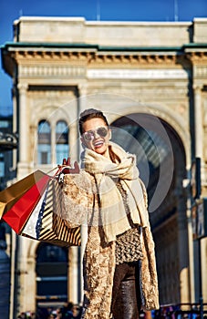 Happy traveller woman near Galleria Vittorio Emanuele II