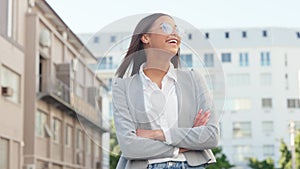 Happy and trendy woman looking away, thinking about career possibilities or opportunities, smiling and laughing while