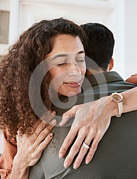 Happy, trust and a couple hugging in their home for support, care or romance in marriage together. Peace, love and