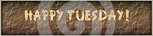 HAPPY TUESDAY written with paint on rock panel background