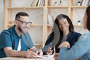 Happy two diverse hr managers listening to funny job applicant.