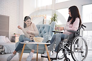 Happy two sisters sharing life stories